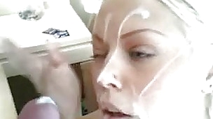 This hot blonde is stroking a long hard wang and using her face hole to give a sloppy blowjob. Her partner strokes his wang and spurts a biggest load of creamy goo all over her enchanting face. After he blows, she sucks the remaining cum out of his wang a